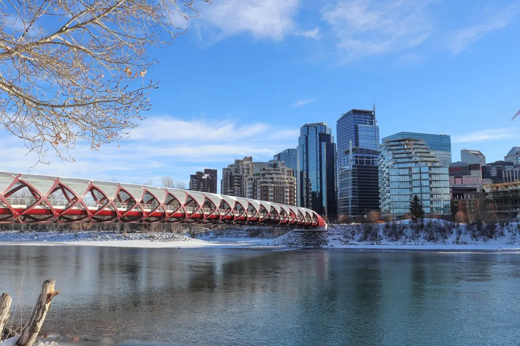 Peace Bridge over the Bow River with the Calgary skyline in winter